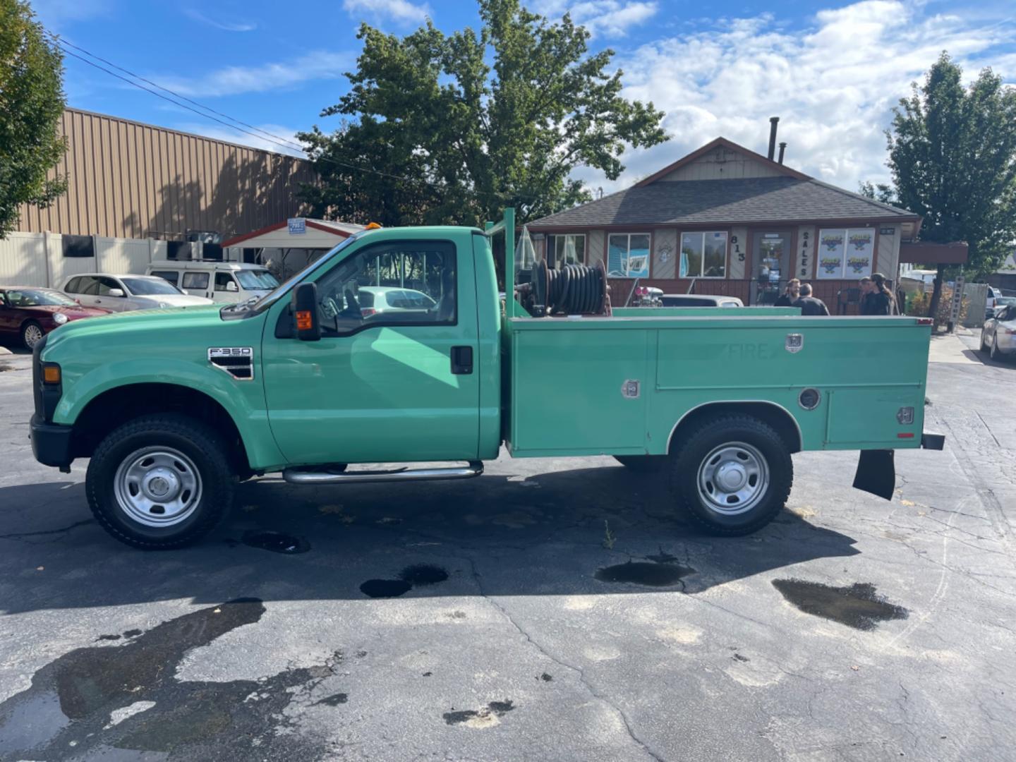 2009 Forest Service Green /Grey Ford F-350 SD XL 4WD (1FDSF35Y19E) with an 6.8L V10 SOHC 30V engine, 6-Speed Manual transmission, located at 813 E Fairview Ave, Meridian , ID, 83642, (208) 336-8230, 43.618851, -116.384010 - Photo#0