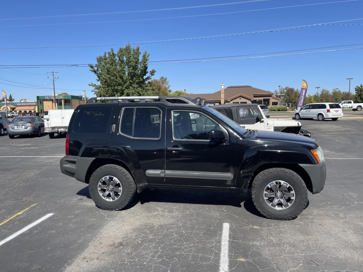 2015 Black /Grey Nissan Xterra PRO-4X (5N1AN0NW9FN) with an 4.0L V6 DOHC 24V engine, 5-Speed Automatic transmission, located at 813 E Fairview Ave, Meridian , ID, 83642, (208) 336-8230, 43.618851, -116.384010 - Photo#6