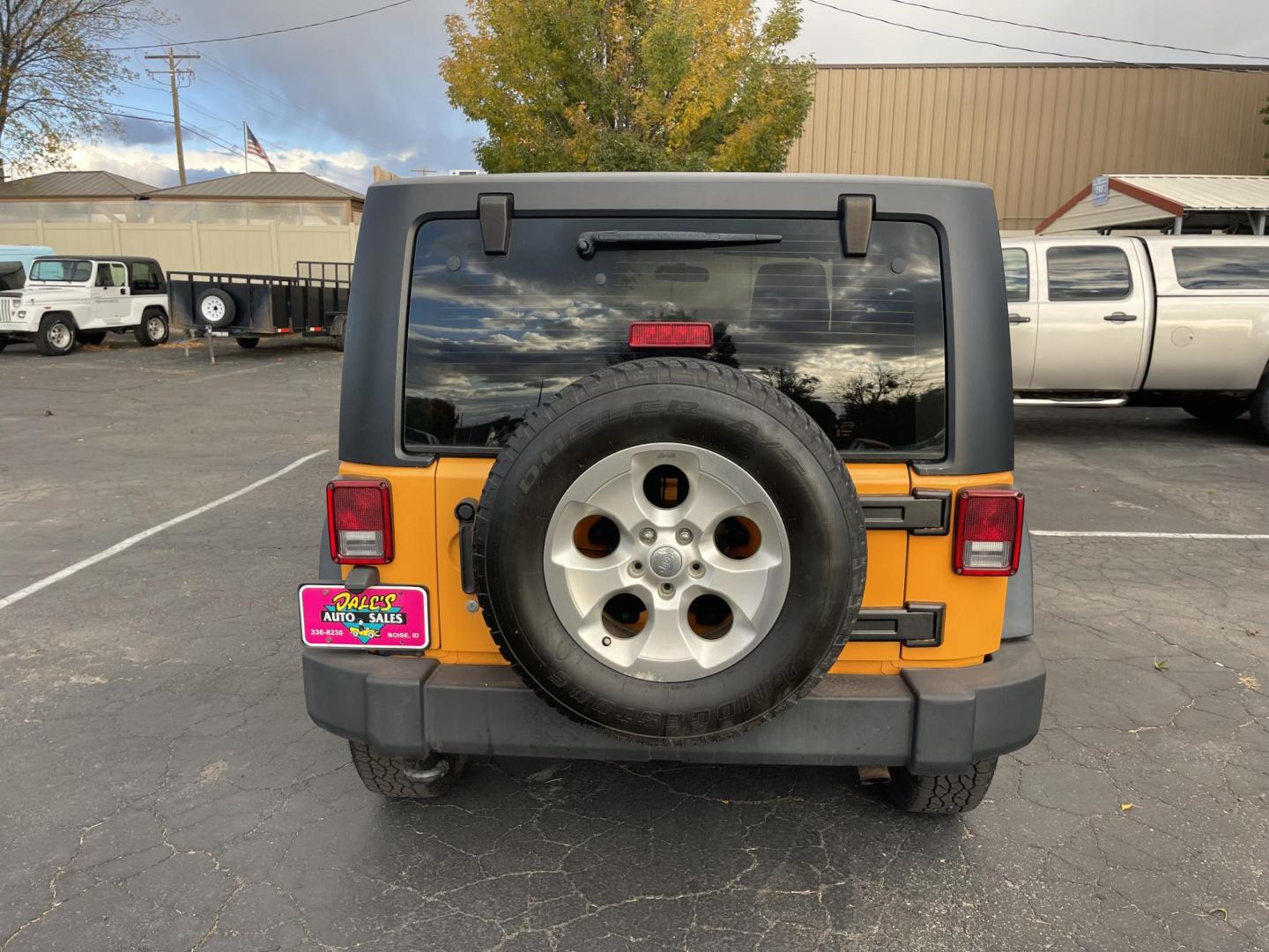 2012 Orange /Black Jeep Wrangler Sport 4WD (1C4AJWAG0CL) with an 3.6L V6 DOHC 24V FFV engine, 6-Speed Manual transmission, located at 813 E Fairview Ave, Meridian , ID, 83642, (208) 336-8230, 43.618851, -116.384010 - Photo#5