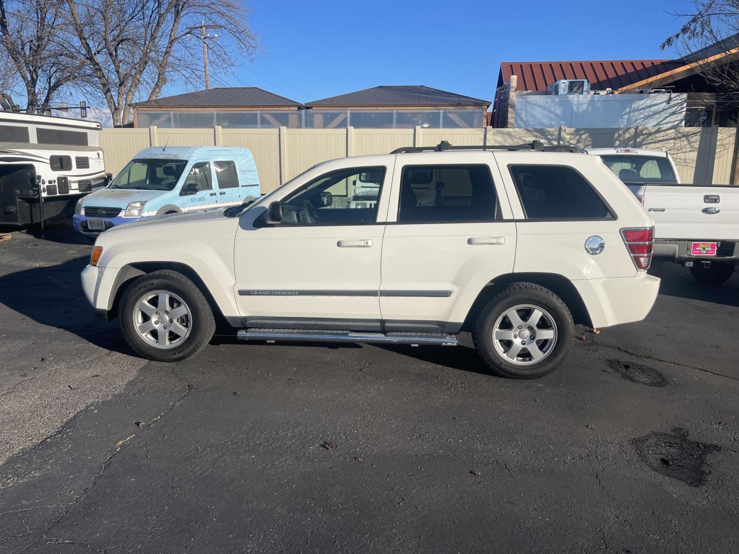 2010 White /Grey Jeep Grand Cherokee Laredo 4WD (1J4PR4GK5AC) with an 3.7L V6 SOHC 12V engine, 5-Speed Automatic transmission, located at 813 E Fairview Ave, Meridian , ID, 83642, (208) 336-8230, 43.618851, -116.384010 - Photo#0