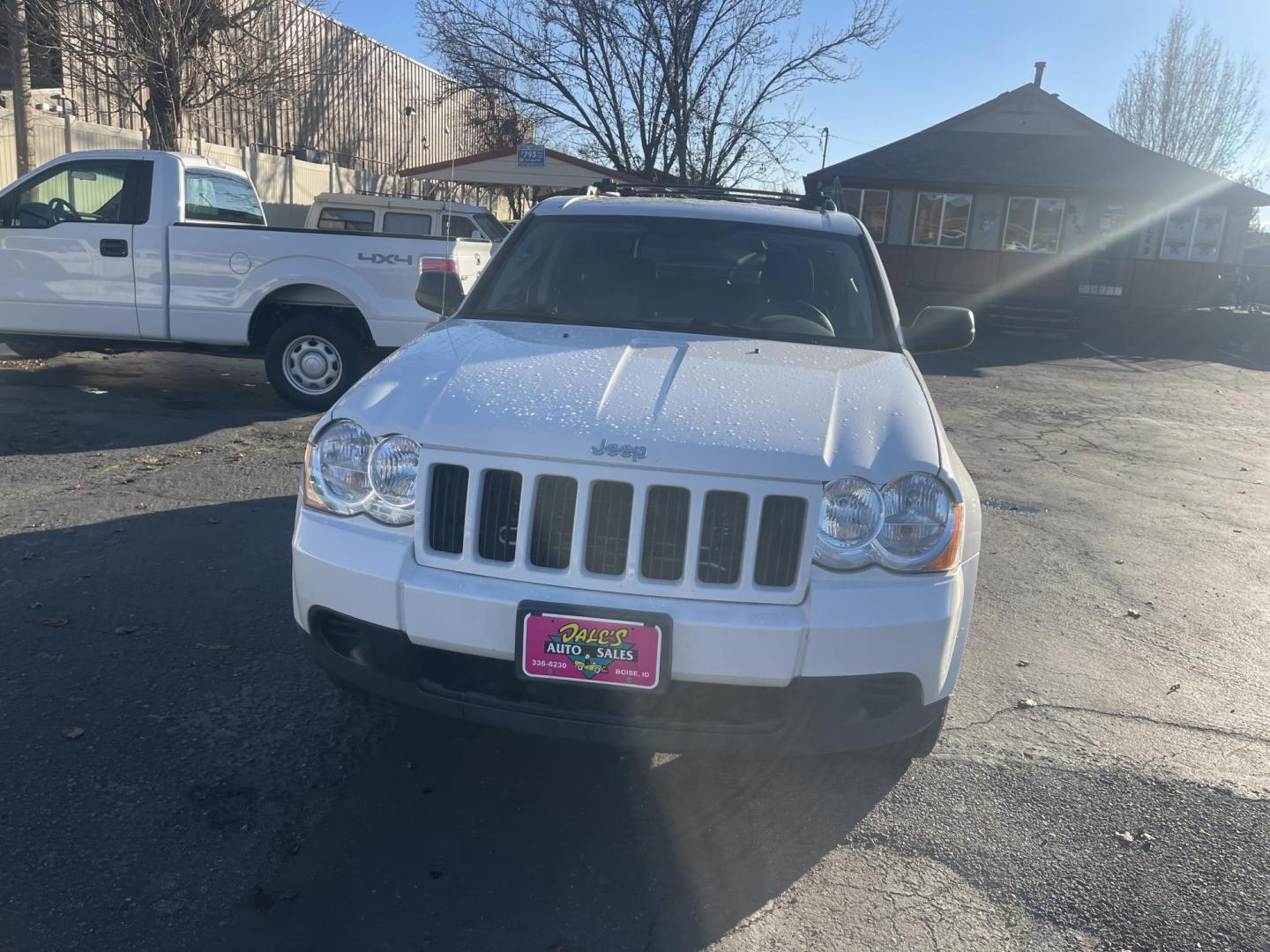 2010 White /Grey Jeep Grand Cherokee Laredo 4WD (1J4PR4GK5AC) with an 3.7L V6 SOHC 12V engine, 5-Speed Automatic transmission, located at 813 E Fairview Ave, Meridian , ID, 83642, (208) 336-8230, 43.618851, -116.384010 - Photo#1